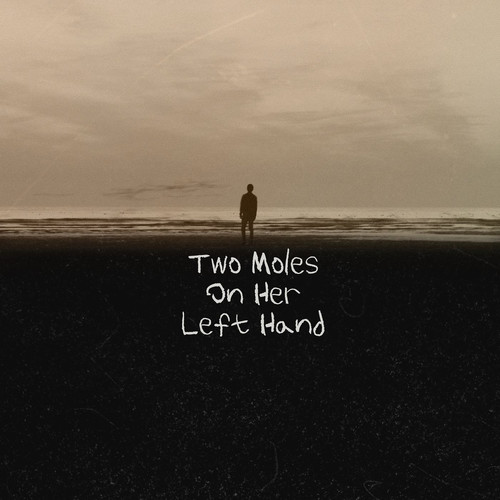 Two Moles on Her Left Hand