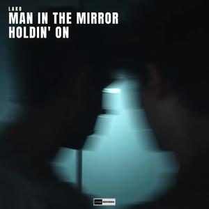 Man In The Mirror Holdin' On