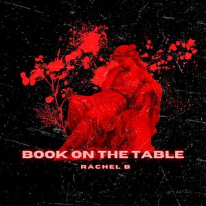 BOOK ON THE TABLE