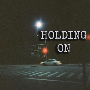 HOLDING ON