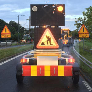 Green jacket, red hair