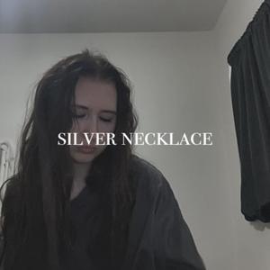 silver necklace (Explicit)
