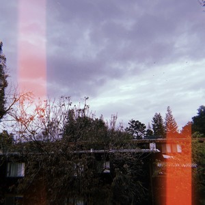 In a room while it starts to rain