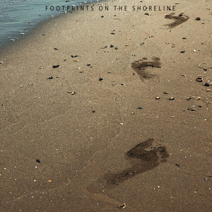 footprints on the shoreline